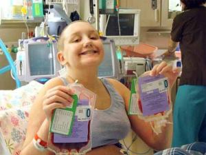 Kent teenager Jayne Johnson holds the two bags of umbilical cord blood Dec. 6 that it is hoped will help her grow a new immune system. The teen received the blood that day as part of a stem-cell transplant