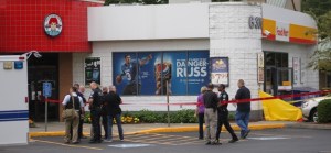 Kent Police investigate the Wednesday morning shooting that resulted in the death of two Shell store employees.