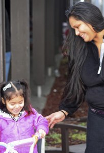 Monica Green watches as her 3-year-old daughter