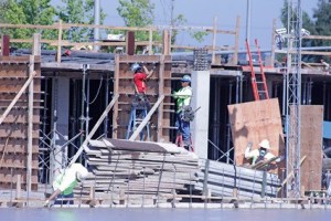Crews work to construct The Platform Apartments in downtown Kent at the corner of West Smith Street and Fourth Avenue North. The apartments are expected to open in September 2014.