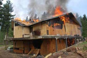 The flames creep during a house-burning drill April 16 on the outskirts of Kent. See the whole firefighting exercise