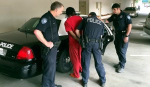 Kent Police capture a man Tuesday morning near the corner of West Meeker Street and Fourth Avenue South who ran a few minutes earlier from his court hearing at the Maleng Regional Justice Center.