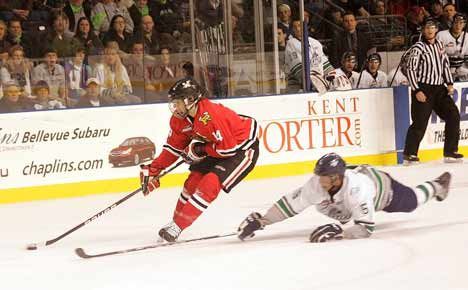 Thunderbirds Brenden Dillon dives to swat away the puck from Winterhawks' Luke Walker Jan. 23. The T-Birds are teaming up with Kent-Meridian High School students to develop a promotional television commercial.