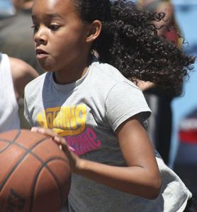 Orlaan Winston of the Dream Team Girls drives during fifth-grade division play at the ShoWare Shootout last weekend. The two-day