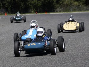 A pack of vintage racers roars around the track on the Pacific Raceways road course. Sports car racers come to Kent this weekend for the J. Tom Masterson Memorial 32nd annual Double “Rational.”