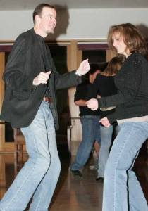 Kent Councilwoman Elizabeth Albertson and her husband and Mark Alberston (master of ceremonies) do the “Twist” Saturday