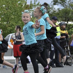 Young performers from Dance Expressions entertain spectators lining Fourth Avenue during the Kent Cornucopia Days Parade on Sunday.