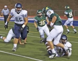 Kentridge wide reciever Carter Johnson is almost taken down by Auburn Riverside's Kevin Thomson