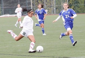 Kentridge’s M’Kenna Hayes braces to fire off a shot against Mount Rainier last week. Hayes and the Chargers upended the Rams 6-2 in a South Puget Sound League North Division game. Kentridge’s Katie Clayton assisted on four goals and added one of her own in the win.
