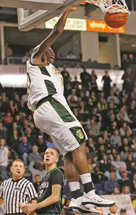 Kentridge's Gary Bell jams it in off a fast break Jan. 28 against Kentwood at the Les Schwab Shootout in Kent