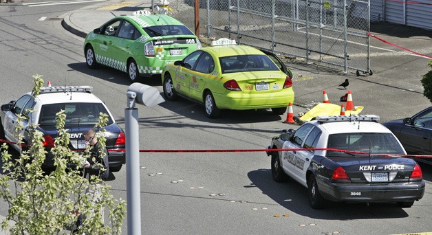 Kent Police shot and killed a man armed with a shotgun or rifle at about 9 a.m. Wednesday at the Kent Transit Center on Railroad Avenue in downtown Kent. Two patrol cars responded to the initial calls of a man with a gun