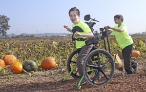 Kyle Hinkle gets a push from his fellow classmate
