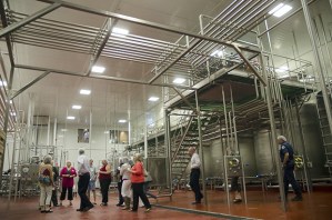 Visitors tour the Smith Brothers Farms’ packing and shipping area of the new milk plant last August. The family-owned company moved from a 90-year-old facility into a newer 50