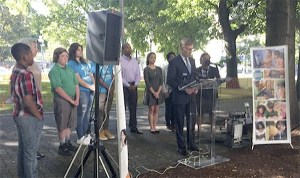 Parents and students intervening in the charter school case stand behind lead attorney Rob McKenna at a press conference on Aug. 23.
