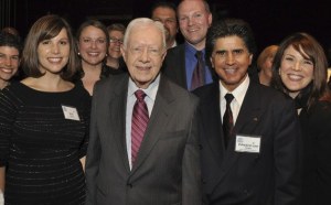 Kent-Meridian High School teacher Lisa Clarke is congratulated by President Jimmy Carter for receiving the 2011 World Affairs Council’s World Educator Award.