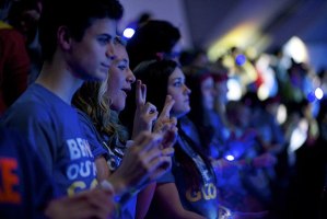 Kentlake student Shelby Greget throws up hand signs during a performance at We Day Seattle