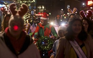 Don Dinsmore guides Santa on his pedicab sleigh along Ramsay Way during Kent Winterfest last year. Winterfest returns to downtown on Saturday. The Kent Lions and its foundation