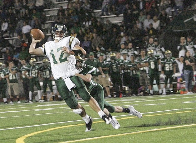 Kentridge's John Hamilton makes an incomplete pass as he his getting tackled by Auburns Lincoln Burt