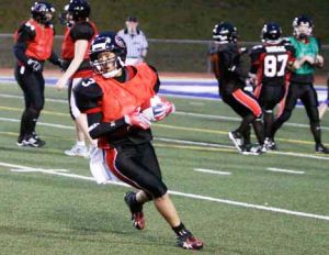 Rachel Gore takes a long pass to the 3-yard line to set up a touchdown at the Majestics' first scrimmage March 20 at French Field.