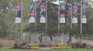Crews put up Hilton HHonors Skate America flags on West Meeker Street to help promote the figure skating competition Oct. 19-21 at the ShoWare Center.