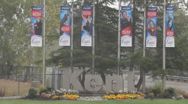 Crews put up Hilton HHonors Skate America flags on West Meeker Street to help promote the figure skating competition Oct. 19-21 at the ShoWare Center.
