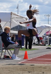 Kentwood High School senior Brittany Woke soars her way to a third-place finish in the long jump at the state 4A track and field meet on Friday. Woke captured the state title in the triple jump on Thursday.