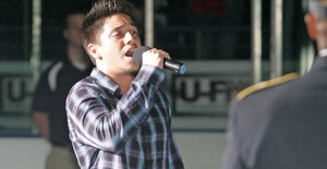 Kent's Stefano Langone sings the national anthem Sept. 24 before a Seattle Thunderbirds hockey game at the ShoWare Center in Kent.