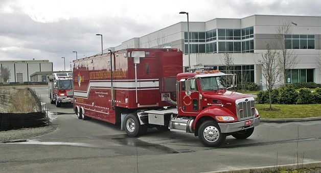 03/10/11 Kent Fire Department hazmat truck and fire engine leaves the scene after inspecting a complaint of a strange smell inside a business at 6300 block of South 199th Place in Kent