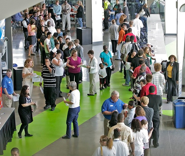 Job applicants fill the ShoWare Center's concourse July 27 in Kent looking to fill positions at the arena.