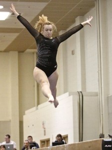 02/19/11 Lynnsey Thielman leaps off the beam Saturday