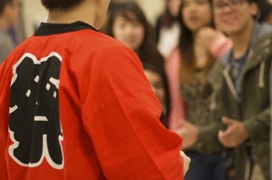 Steven Dang’s red Soran Bushi shirt symbolizes him as the leader of the dance group.