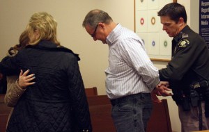 A King County corrections officer takes Ken Sharp