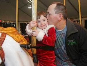 Steve Snyder kisses his daughter Brandi