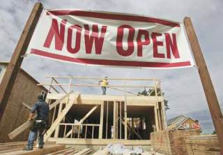 Workers build homes at The Ridge at Panther Lake