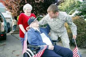 John Paquette prepares to hug his grandfather