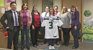 Appearing with the donated Russell Wilson Seahawks jersey are
