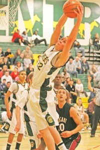 Kentridge's Craig Rasmussen goes high for a rebound during a game against Kentlake in January. Rasmussen will join forces with Kentridge's Devin Topps and Sean Ringor for the ShoWare Shootout