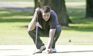 Kent’s Brandon Brown lines up a putt Saturday