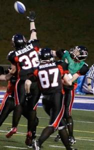 Majestics' veteran Angie Andrew (32) swats a pass from quarterback Michel Volk