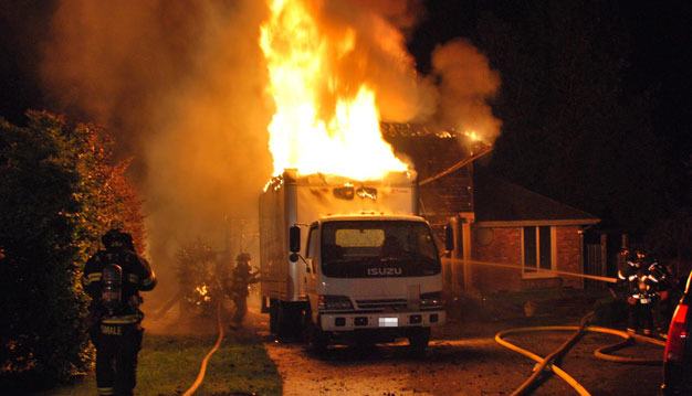 A fireworks-related fire heavily damages a Kent-area home last Fourth of July.