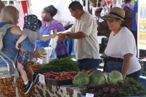 The King County Board of Health decided to delay any decision about an increase in farmers market fees until its January meeting.