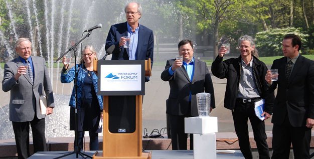 Attendees at the Water Supply Forum in Bellevue toast to what's expected to be a plentiful water supply in the central Puget Sound area over the next 50 years.