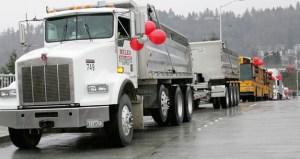Kent-based Miles Sand and Gravel trucks head over the South 228th Street overpass in 2009 after completion of a railroad grade separation project.