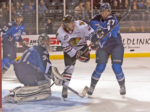 Portland's Presten Kopeck gets in front of the goal as his shot flies by Thunderbirds' Evan Wardley