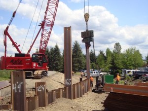 Crews install a sheet metal wall last year along the Briscoe Desimone levee along the Green River. Crews will complete another section of the levee this spring.