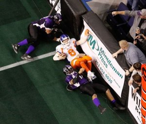 03/12/10 Grizzlies Quarterback Matt Bassoenor gets crushed into the dasher boards by Predators John Fields