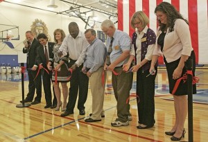 Cutting the ceremonial ribbon for the New Kent-Meridian gym is
