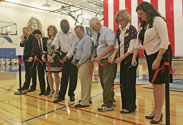Cutting the ceremonial ribbon for the New Kent-Meridian gym is