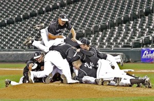 Kentwood dog piles the pitcher's mound after the last out to win the 4A Baseball Championships at Safeco Saturday