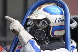 Jerry 'The King' Ruth points to one of his crew members as he revs up his restored 1969 Top Fuel dragster.
